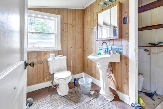 1357 W State Highway 154, Quitman, TX 75783 - bathroom with wood walls and tile patterned floors