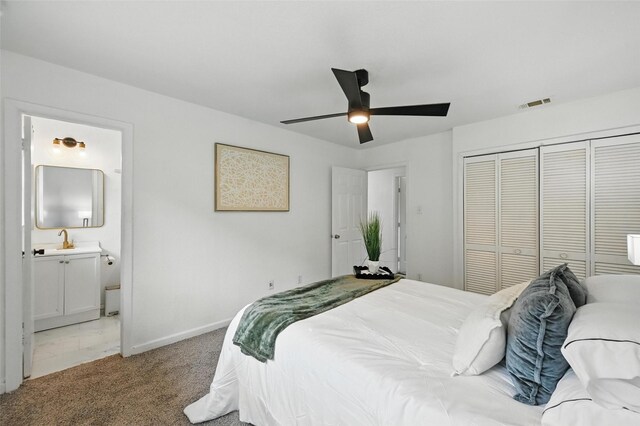 3105 Dupree St, Irving, TX 75062 - bedroom featuring a closet, light carpet, ensuite bath, and a ceiling fan