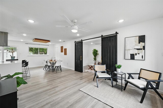 3105 Dupree St, Irving, TX 75062 - sitting room with a barn door, recessed lighting, ceiling fan, and light wood finished floors