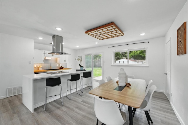 3105 Dupree St, Irving, TX 75062 - dining area with light wood-style flooring and recessed lighting