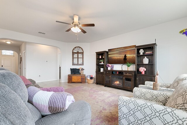 1112 Metaline Trl, Fort Worth, TX 76177 - living room featuring arched walkways, ceiling fan, and tile patterned floors