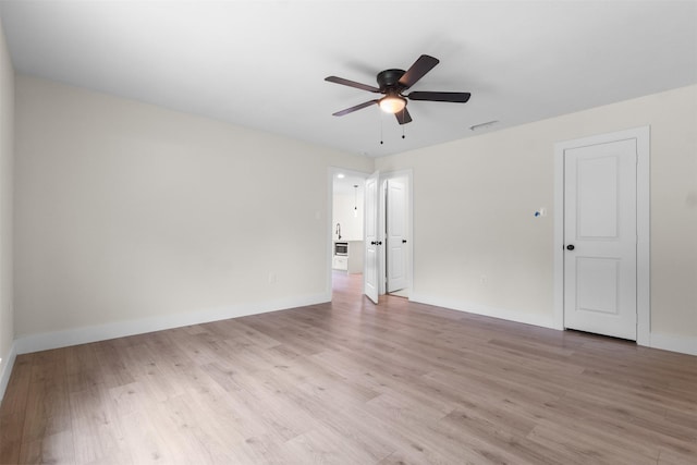 2117 Andrew Ave, Fort Worth, TX 76105 - empty room featuring light wood-type flooring and ceiling fan