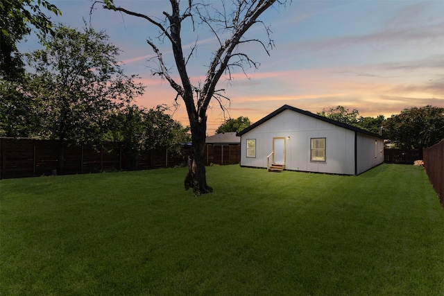 2117 Andrew Ave, Fort Worth, TX 76105 - yard at dusk featuring entry steps and a fenced backyard