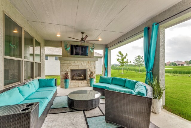 8509 Cocobolo Dr, Denton, TX 76207 - view of patio with an outdoor living space with a fireplace and ceiling fan