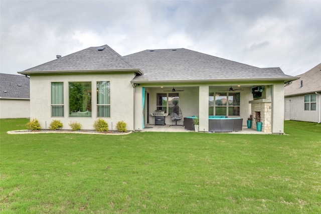 8509 Cocobolo Dr, Denton, TX 76207 - back of property featuring a ceiling fan, a patio, roof with shingles, and a lawn