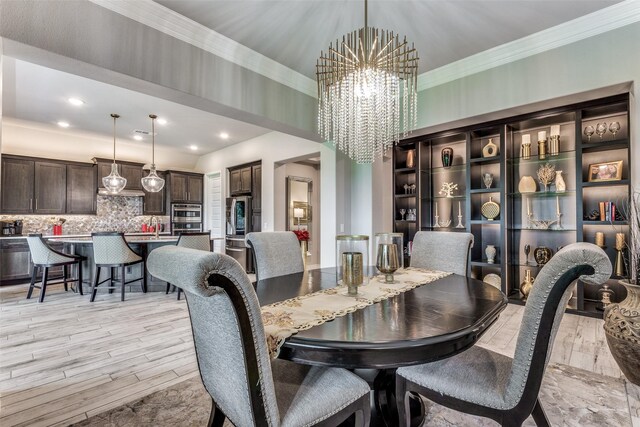 8509 Cocobolo Dr, Denton, TX 76207 - dining room with a chandelier, light wood-style flooring, ornamental molding, and recessed lighting