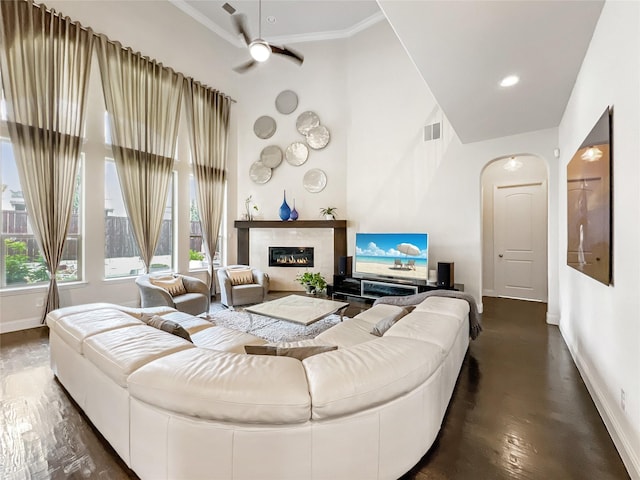 1500 Whistle Brook Dr, Allen, TX 75013 - living room with a high ceiling, a high end fireplace, a ceiling fan, ornamental molding, and recessed lighting