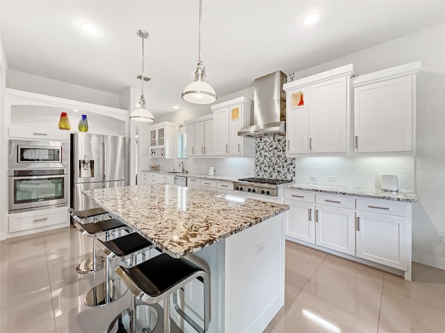 1500 Whistle Brook Dr, Allen, TX 75013 - kitchen featuring stainless steel appliances, wall chimney range hood, light tile patterned floors, backsplash, and recessed lighting