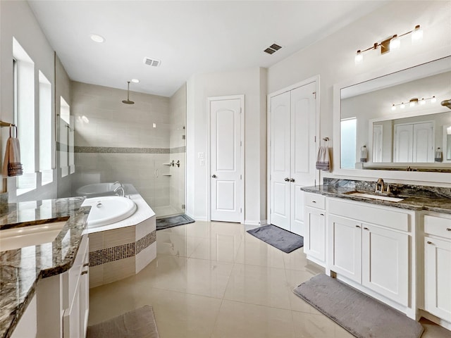 1500 Whistle Brook Dr, Allen, TX 75013 - bathroom with a shower stall, two vanities, a garden tub, and tile patterned flooring