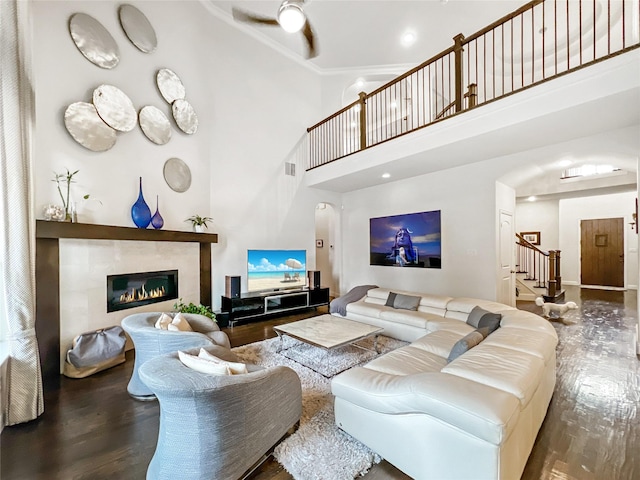 1500 Whistle Brook Dr, Allen, TX 75013 - living room featuring wood finished floors, stairs, a fireplace, crown molding, and a high ceiling