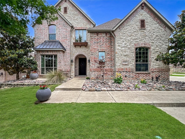 1500 Whistle Brook Dr, Allen, TX 75013 - french country home with a front lawn, stone siding, and brick siding