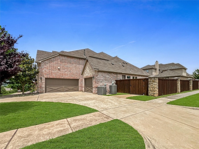 1500 Whistle Brook Dr, Allen, TX 75013 - view of side of property featuring brick siding, concrete driveway, roof with shingles, and an attached garage