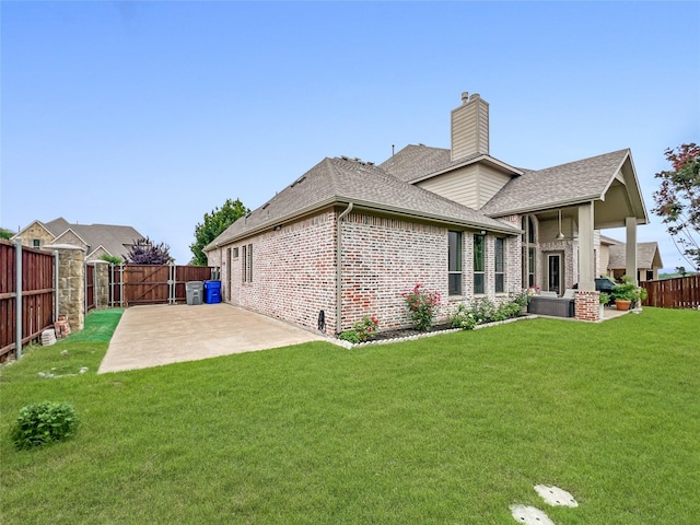 1500 Whistle Brook Dr, Allen, TX 75013 - back of house with a patio, brick siding, a fenced backyard, roof with shingles, and a chimney