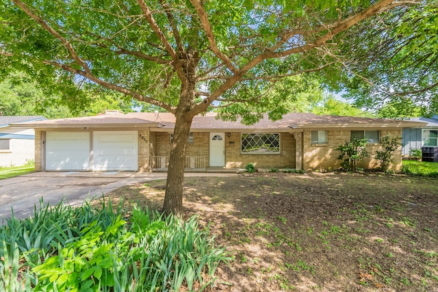 5905 Wheaton Dr, Fort Worth, TX 76133 - ranch-style house featuring brick siding, asphalt driveway, an attached garage, and a chimney