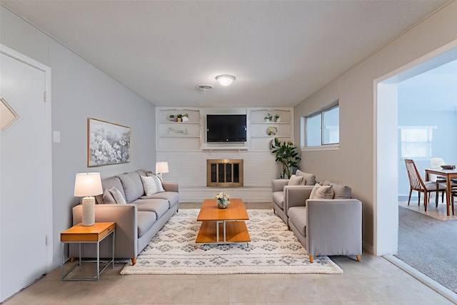 5905 Wheaton Dr, Fort Worth, TX 76133 - living area with built in shelves and a fireplace