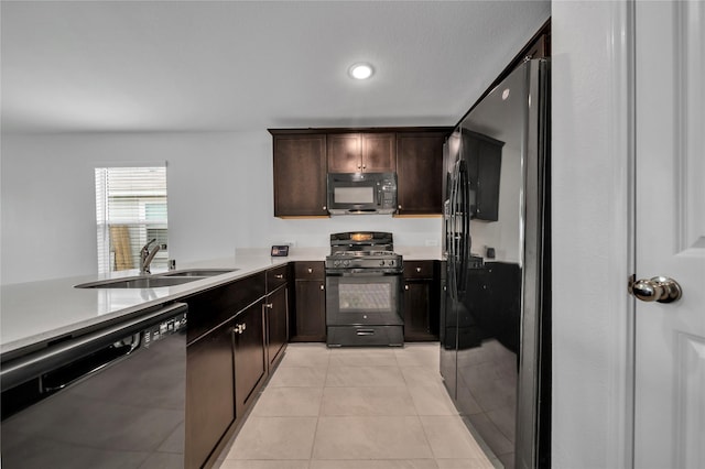 3165 Crestone Dr, Crandall, TX 75114 - kitchen featuring black appliances, light countertops, light tile patterned floors, dark brown cabinets, and recessed lighting