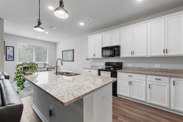 6932 Sulphur Ct, China Spring, TX 76633 - kitchen featuring black appliances, recessed lighting, white cabinetry, hanging light fixtures, and light stone countertops