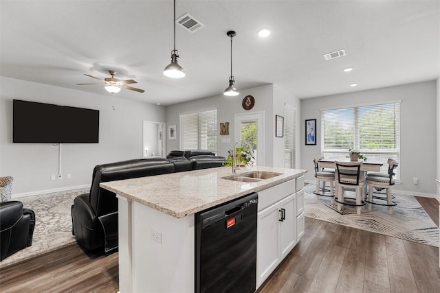 6932 Sulphur Ct, China Spring, TX 76633 - kitchen with black dishwasher, open floor plan, dark wood-type flooring, an island with sink, and white cabinetry