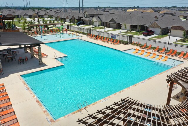 749 Hidden Feather Dr, Lavon, TX 75166 - community pool with a residential view, a patio, and a pergola