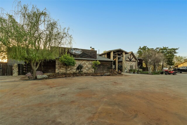 14142 Maida Dr, Pilot Point, TX 76258 - view of front of property featuring stone siding and a chimney