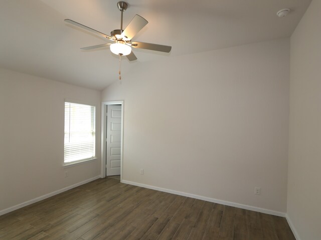 14142 Maida Dr, Pilot Point, TX 76258 - unfurnished room featuring dark wood-style flooring, ceiling fan, lofted ceiling, and a smoke detector
