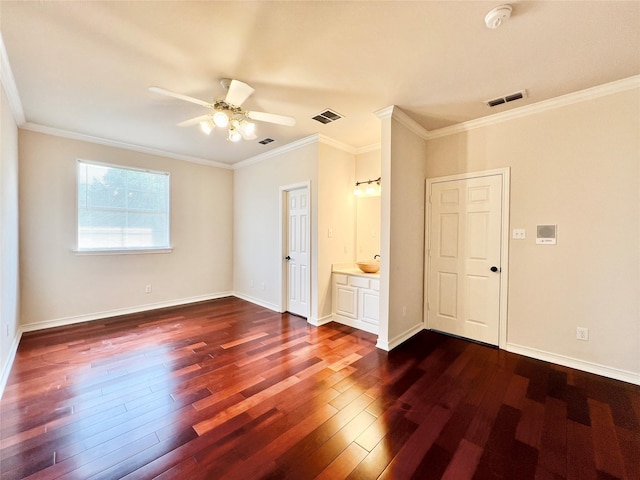 1016 Santiago Trl, Wylie, TX 75098 - unfurnished bedroom with dark wood-style flooring, crown molding, ceiling fan, and ensuite bathroom