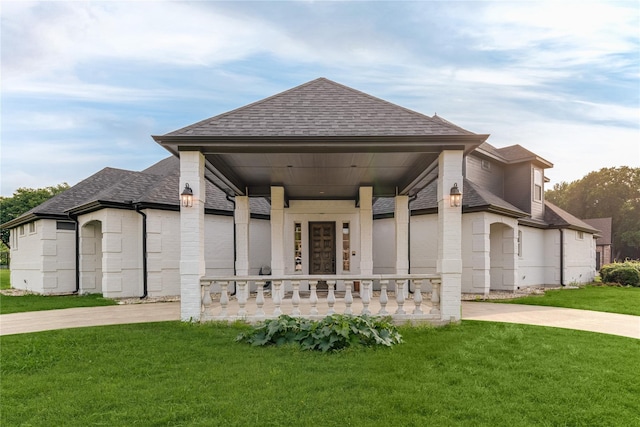 1016 Santiago Trl, Wylie, TX 75098 - view of front of house featuring a porch, a shingled roof, a front yard, and brick siding