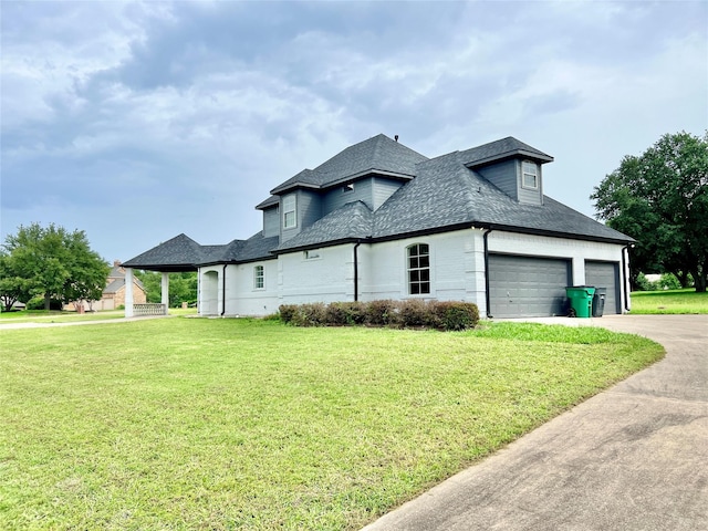 1016 Santiago Trl, Wylie, TX 75098 - view of side of home featuring a lawn, driveway, an attached garage, and a shingled roof