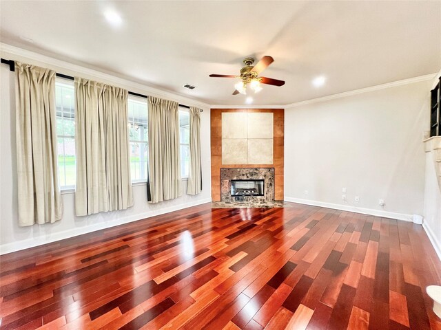 1016 Santiago Trl, Wylie, TX 75098 - unfurnished living room featuring dark wood-type flooring, a fireplace, ceiling fan, ornamental molding, and recessed lighting