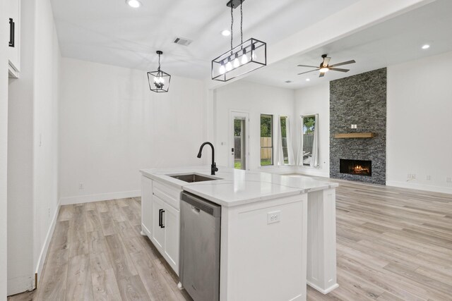 255 Kathryns Ct, Mount Pleasant, TX 75455 - kitchen featuring dishwasher, light wood-style flooring, white cabinetry, ceiling fan, and open floor plan