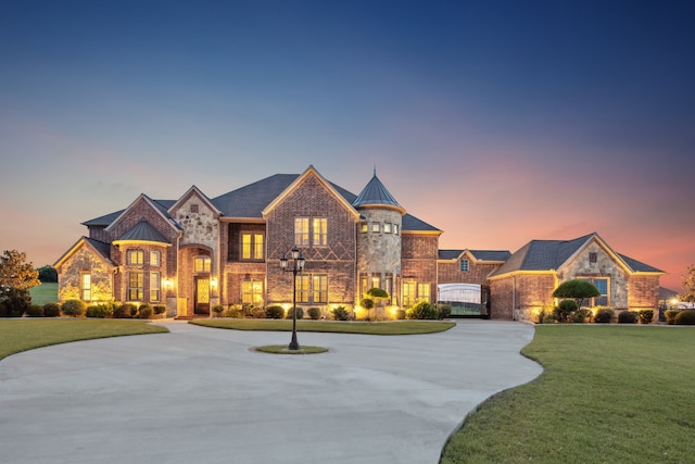 211 Tanner Creek Cir, Sunnyvale, TX 75182 - french country inspired facade with a front lawn, brick siding, stone siding, and curved driveway