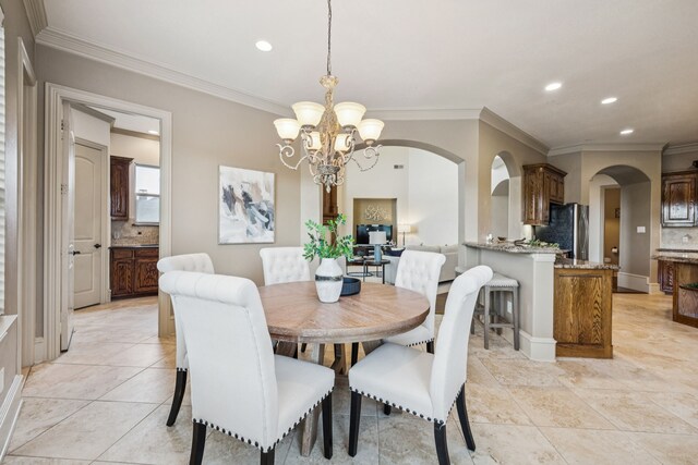 211 Tanner Creek Cir, Sunnyvale, TX 75182 - dining room featuring a chandelier, arched walkways, ornamental molding, recessed lighting, and light tile patterned floors