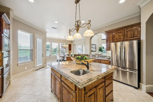 211 Tanner Creek Cir, Sunnyvale, TX 75182 - kitchen featuring appliances with stainless steel finishes, arched walkways, light tile patterned floors, recessed lighting, and a center island with sink