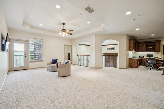 211 Tanner Creek Cir, Sunnyvale, TX 75182 - sitting room with light carpet, a tray ceiling, recessed lighting, ceiling fan, and built in study area