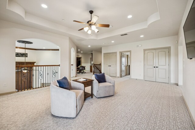 211 Tanner Creek Cir, Sunnyvale, TX 75182 - sitting room featuring carpet flooring, ceiling fan, a tray ceiling, recessed lighting, and arched walkways