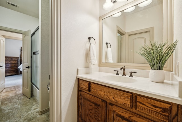 211 Tanner Creek Cir, Sunnyvale, TX 75182 - ensuite bathroom featuring vanity, an enclosed shower, and stone finish flooring