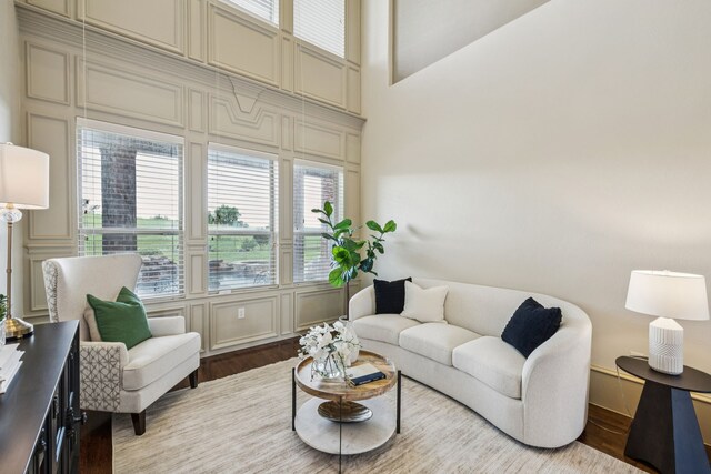211 Tanner Creek Cir, Sunnyvale, TX 75182 - living room featuring a decorative wall and wood finished floors