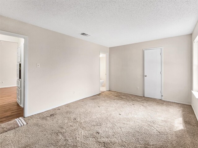 631 Sharp St, Mansfield, TX 76063 - carpeted empty room featuring a textured ceiling and baseboards