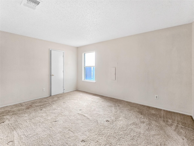 631 Sharp St, Mansfield, TX 76063 - carpeted spare room featuring a textured ceiling and baseboards