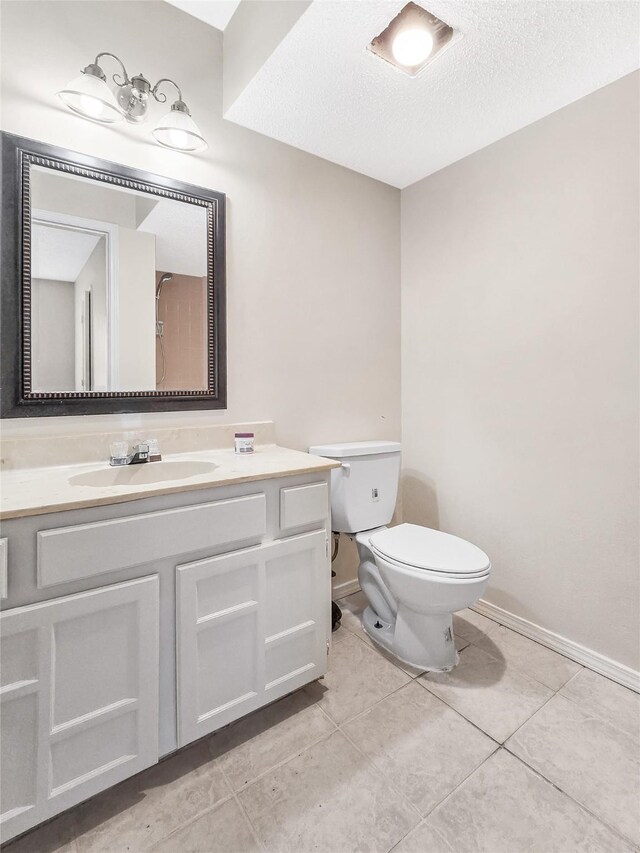 631 Sharp St, Mansfield, TX 76063 - bathroom with vanity, a textured ceiling, and tile patterned flooring