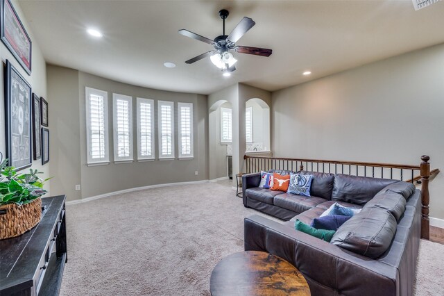 917 Stone Cottage Ln, Mckinney, TX 75069 - carpeted living room featuring recessed lighting, a ceiling fan, and arched walkways