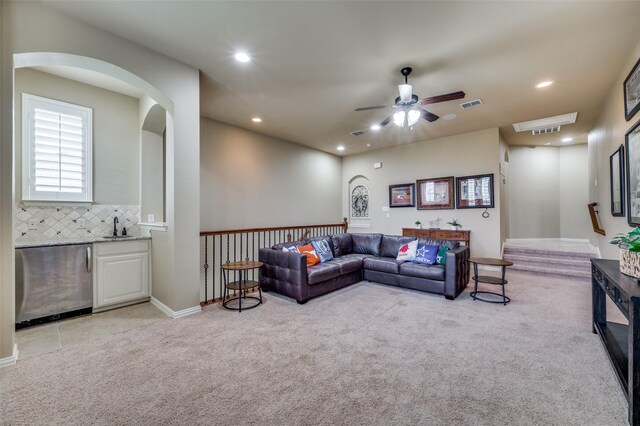 917 Stone Cottage Ln, Mckinney, TX 75069 - living area featuring light carpet, recessed lighting, a ceiling fan, and arched walkways