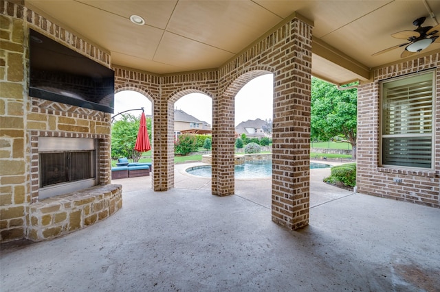 917 Stone Cottage Ln, Mckinney, TX 75069 - view of patio / terrace with an outdoor stone fireplace and ceiling fan