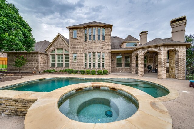917 Stone Cottage Ln, Mckinney, TX 75069 - view of pool featuring a patio area and a pool with connected hot tub