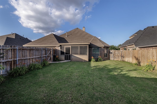 1701 Fair Oaks Ln, Royse City, TX 75189 - rear view of house with brick siding, a fenced backyard, roof with shingles, and a chimney
