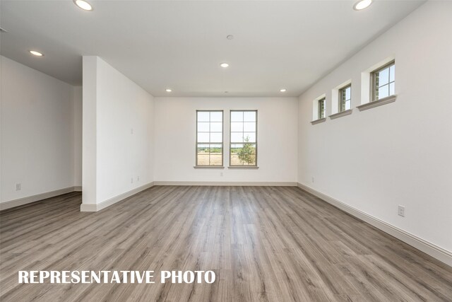 428 Parkside Dr, Argyle, TX 76226 - spare room featuring healthy amount of natural light, recessed lighting, and light wood-type flooring
