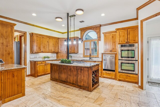 10133 Leaping Buck Pt, Fort Worth, TX 76126 - kitchen with stainless steel appliances, tasteful backsplash, stone tile flooring, recessed lighting, and crown molding