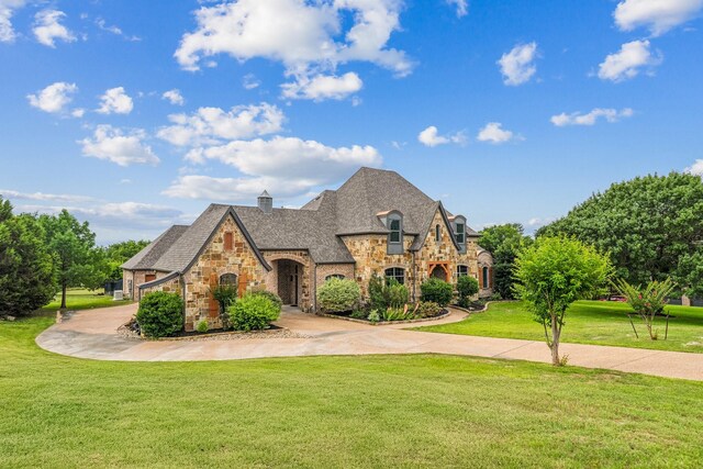 10133 Leaping Buck Pt, Fort Worth, TX 76126 - view of front of home featuring stone siding and a front yard