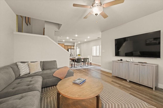 3109 Ethan Ln, Wylie, TX 75098 - living area featuring light wood-style floors, recessed lighting, stairway, and ceiling fan