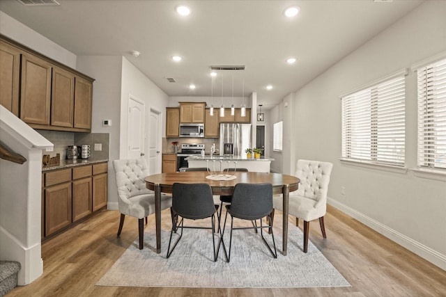 3109 Ethan Ln, Wylie, TX 75098 - dining area with light wood-style floors and recessed lighting